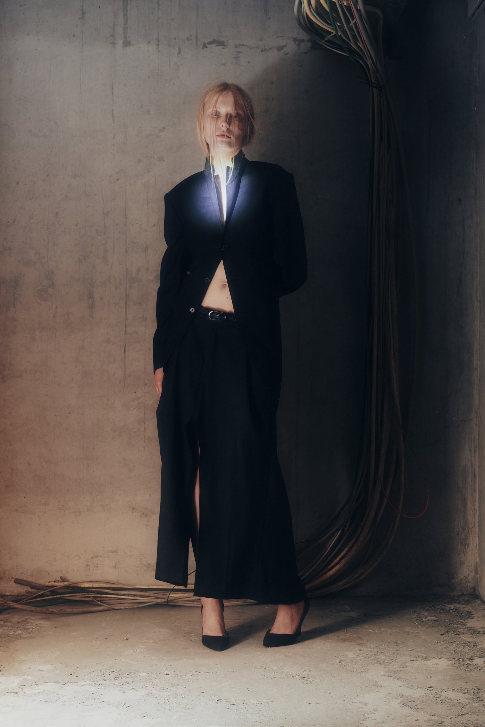 The Upcycled Open-Back Blazer worn open with the Upcycled Suit Skirt and pointed heels