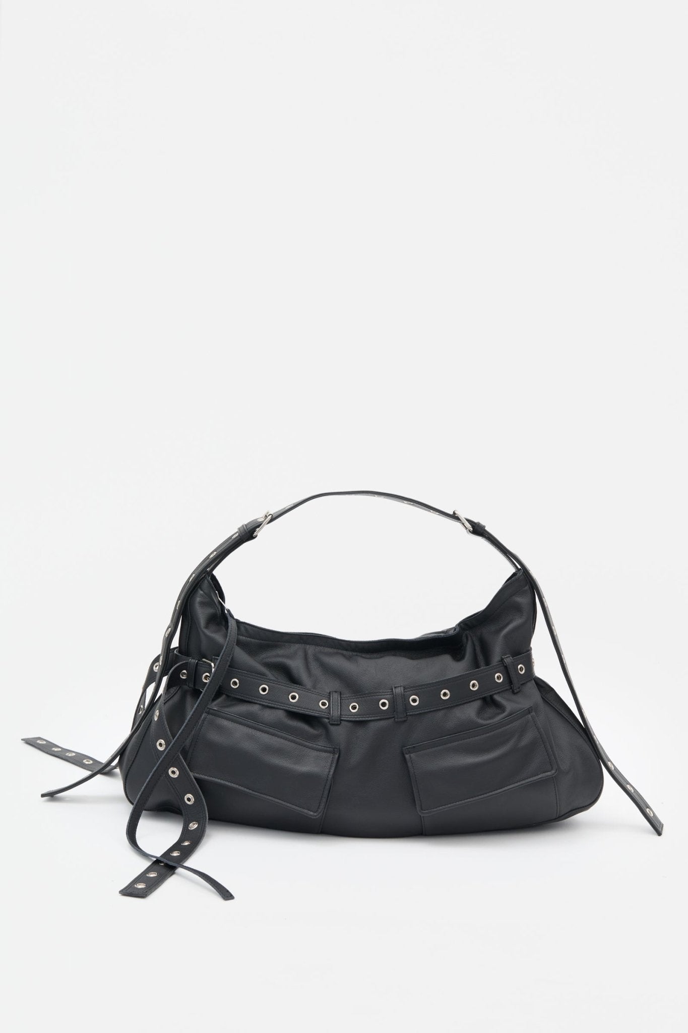 Black leather handbag with decorative elements on a white background
