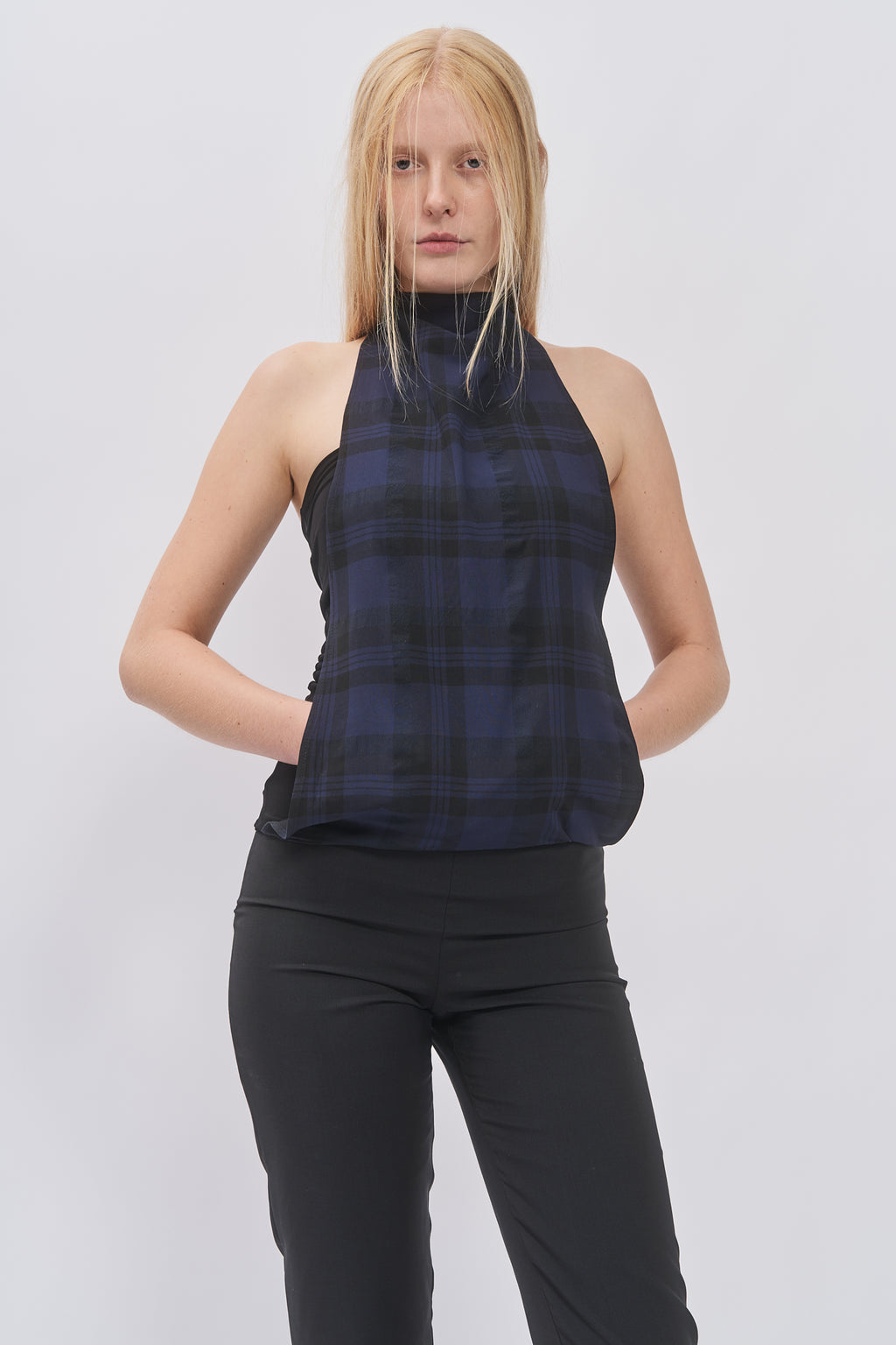 Close-up of Taus Two-Layer Halterneck Top in navy and black check with high halter neckline
