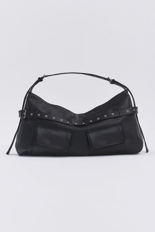 Taus Juho Bag in black leather, flat lay front view with two flap pockets, eyelet belt and shoulder strap