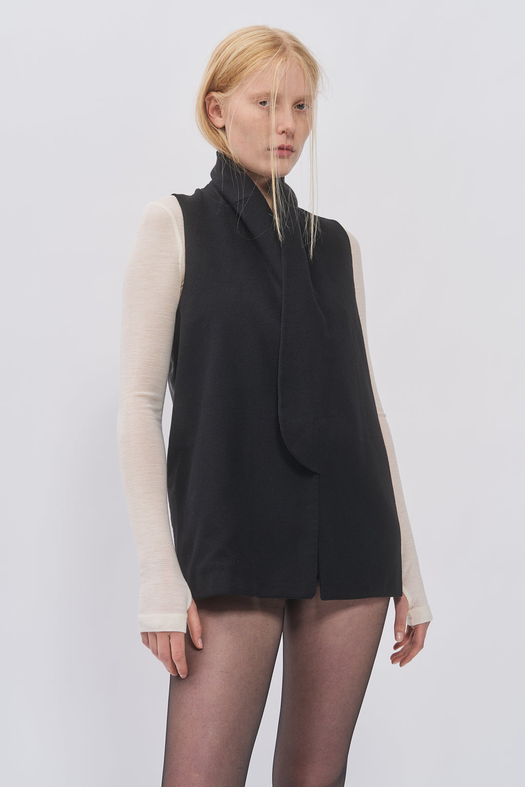 Close-up of Taus Long Waistcoat in black showing the long shawl collar and clean front