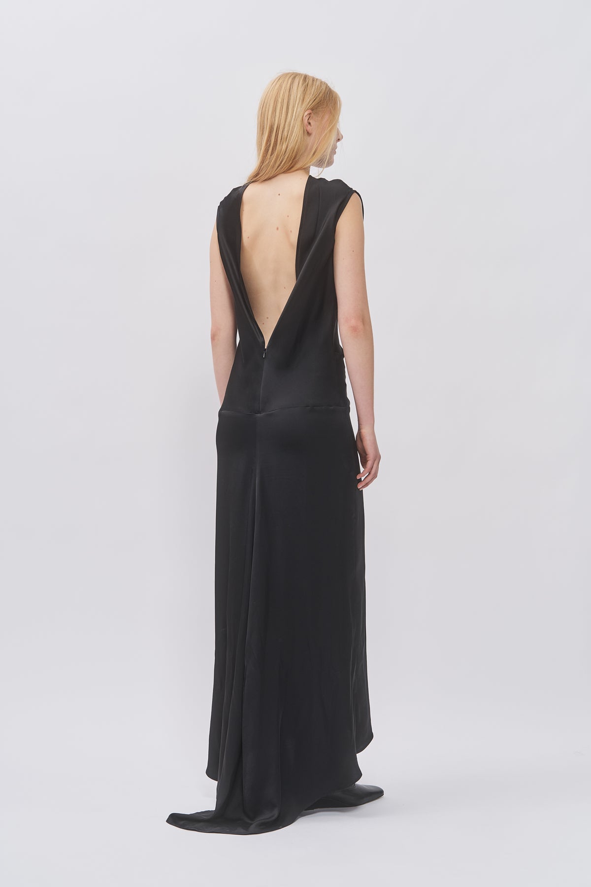 Back view of Taus Open-Back Dress in black with deep V open back and floor-length hem