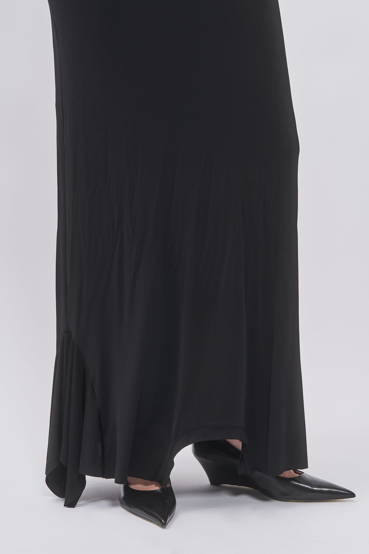 Hem detail of Taus T-Shirt Hem Dress in black showing the asymmetric flared hem