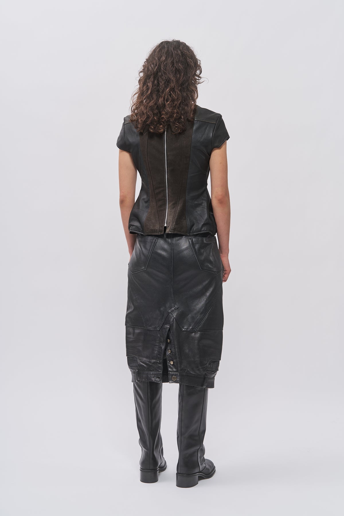 Back view of Taus Upcycled Leather Top in black with centre-back zip