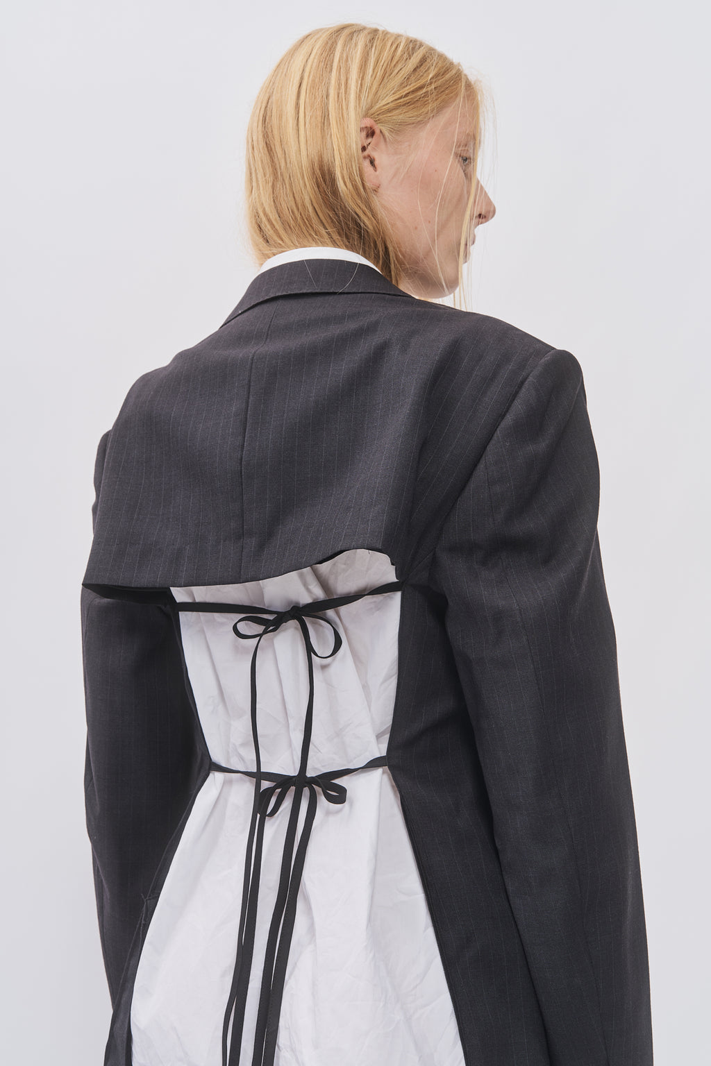 Detail of Taus Upcycled Open-Back Blazer showing the cut-out back with black tie closure