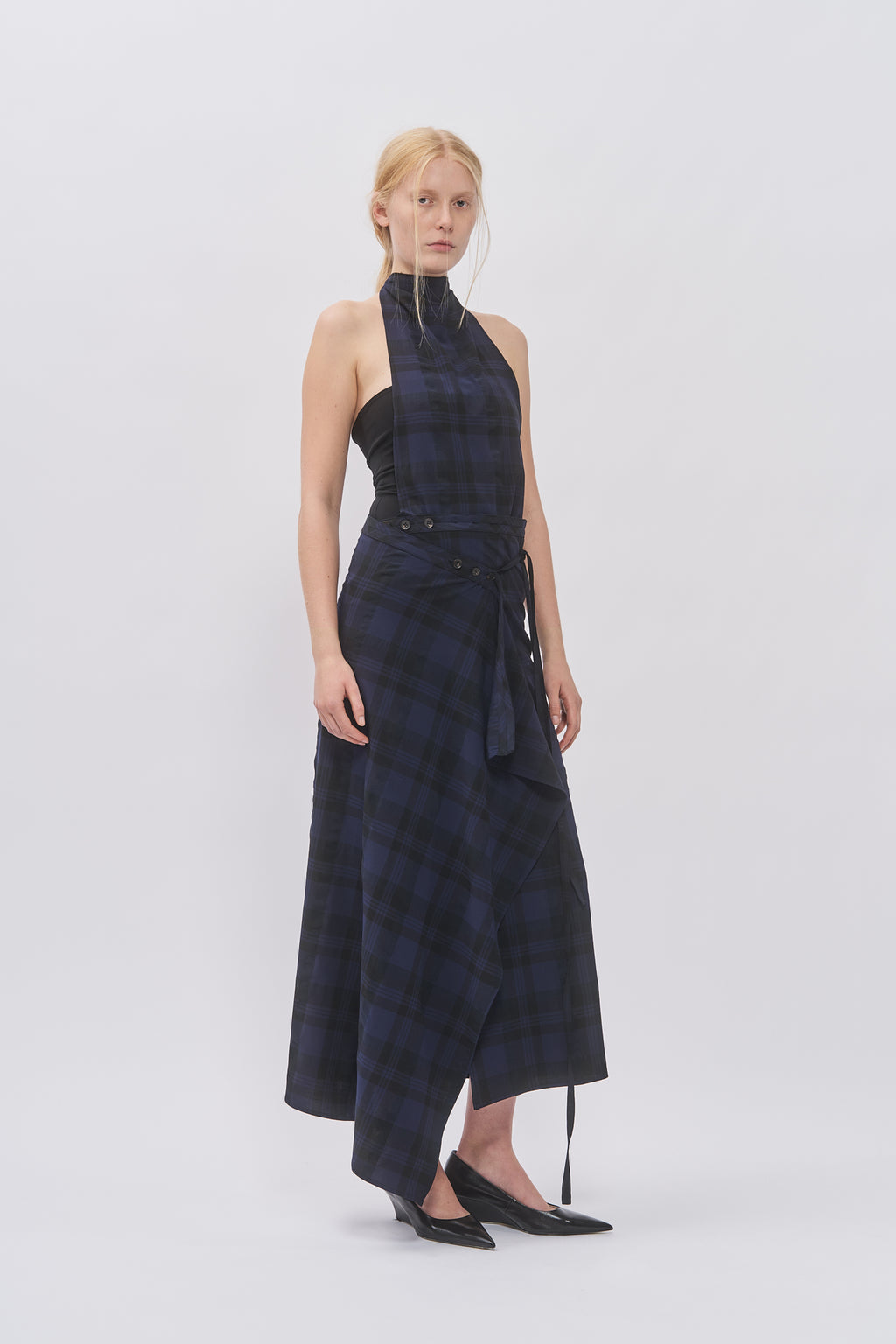 Taus Wrap Skirt in navy and black check with draped tie front, worn with the matching halterneck top